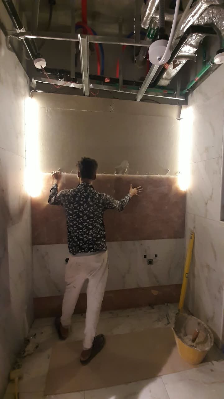 Polished grey porcelain bathroom tiling finish after tiling